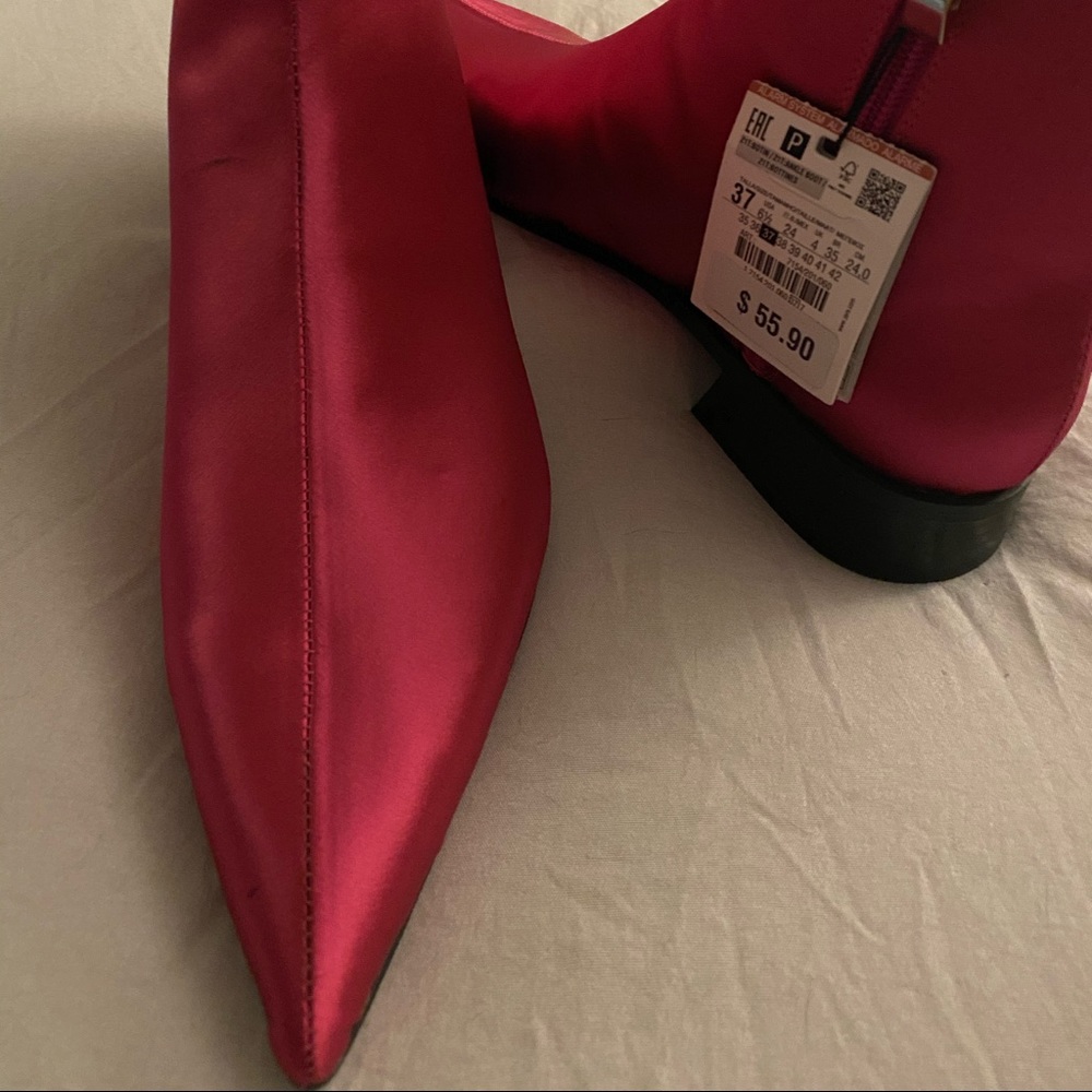 Tags taken off. Came with an ink mark but not noticeable when on. Never worn.